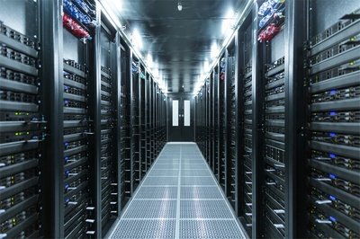 Aerial view of a large bitcoin mining farm with rows of containers.